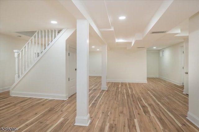 basement featuring hardwood / wood-style floors