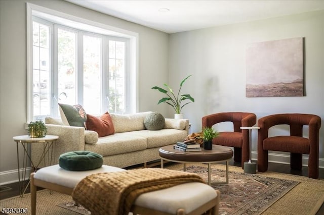 living area with hardwood / wood-style flooring