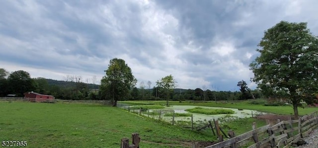 view of yard with a rural view