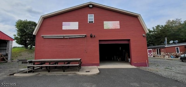 back of house with a garage