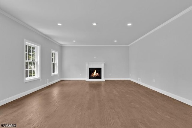 unfurnished living room with dark hardwood / wood-style flooring and crown molding