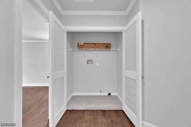 washroom with dark hardwood / wood-style flooring, crown molding, and hookup for a washing machine