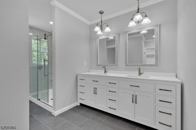 bathroom with crown molding, vanity, a notable chandelier, and walk in shower