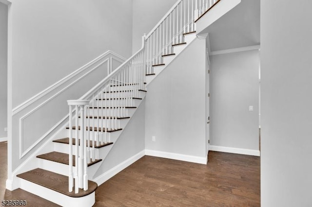 stairway featuring hardwood / wood-style flooring