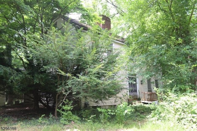 view of side of property with a deck