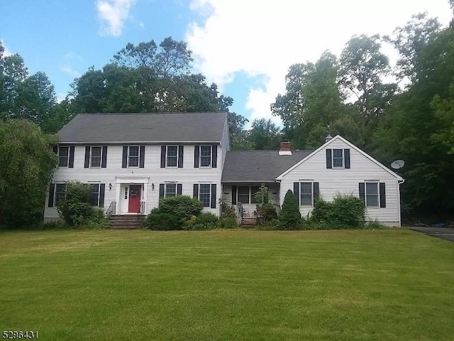 colonial inspired home with a front yard