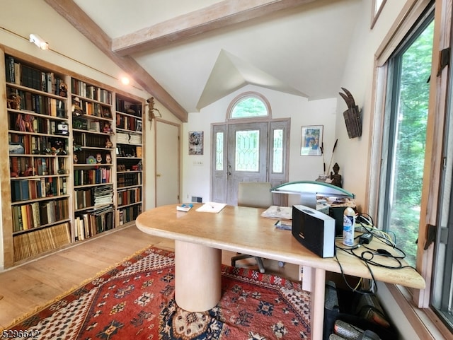 office space featuring wood-type flooring and vaulted ceiling with beams