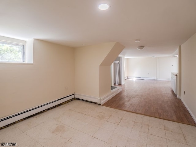 bonus room featuring baseboard heating and light wood-type flooring