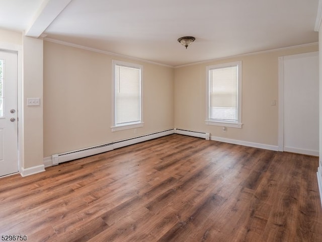 spare room with wood-type flooring, a baseboard radiator, and ornamental molding