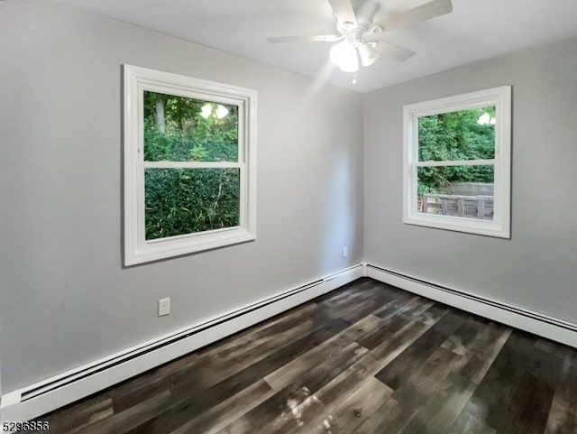 empty room with hardwood / wood-style flooring, ceiling fan, and baseboard heating