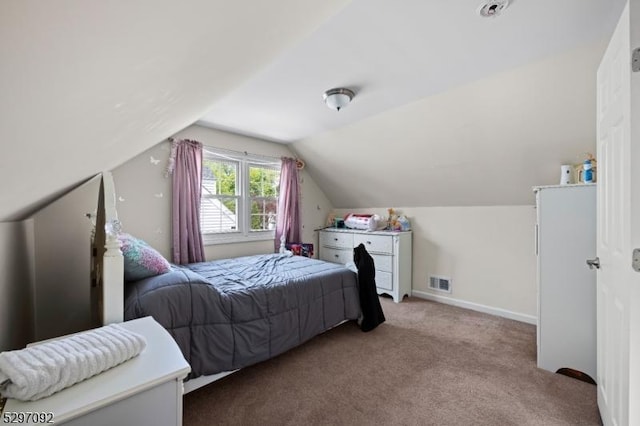 bedroom featuring carpet, lofted ceiling, and baseboards