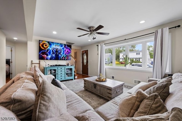 living room with recessed lighting, a ceiling fan, and baseboards