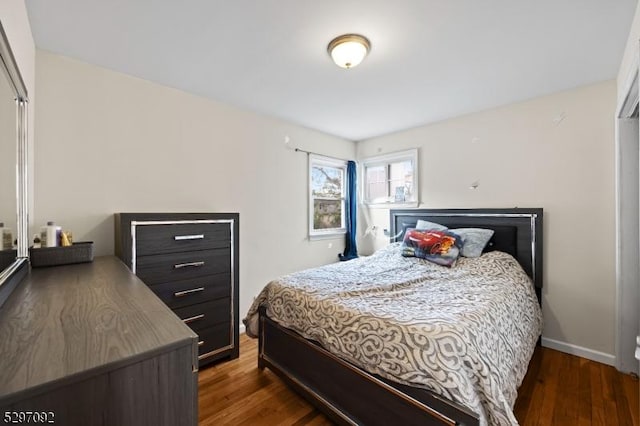 bedroom with wood finished floors