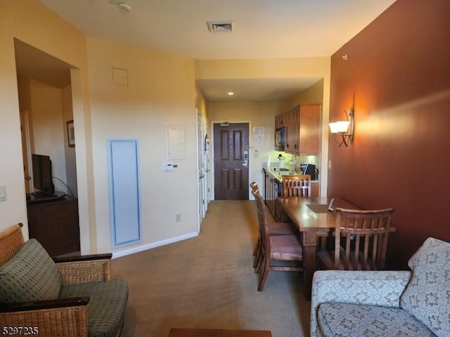 view of carpeted dining area