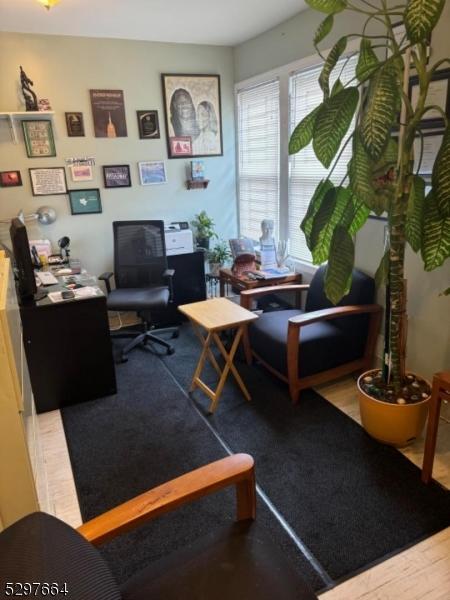 home office with wood-type flooring