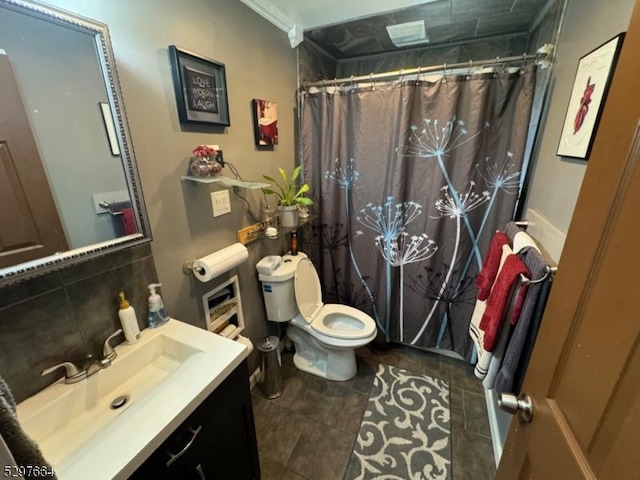 bathroom with a shower with curtain, vanity, tile patterned flooring, and toilet