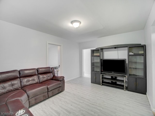 living room with light hardwood / wood-style flooring