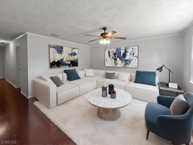 living room with ornamental molding, ceiling fan, hardwood / wood-style floors, and a textured ceiling