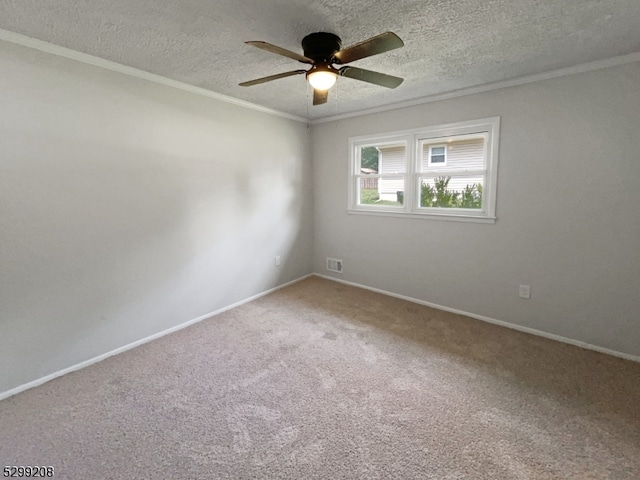 carpeted empty room with a textured ceiling, crown molding, and ceiling fan