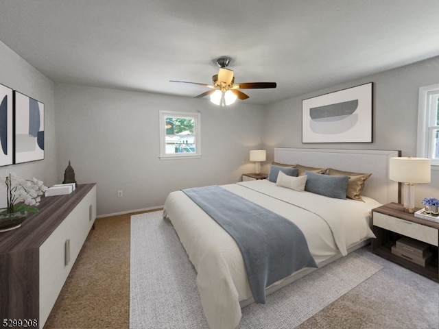 bedroom featuring light colored carpet and ceiling fan