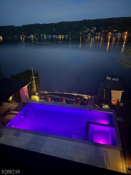 pool at twilight with a water view