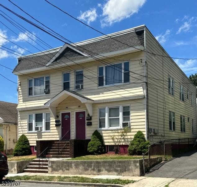 1414 Franklin St, Hillside Twp, NJ 07205 - view of front of house featuring roof with shingles and cooling unit