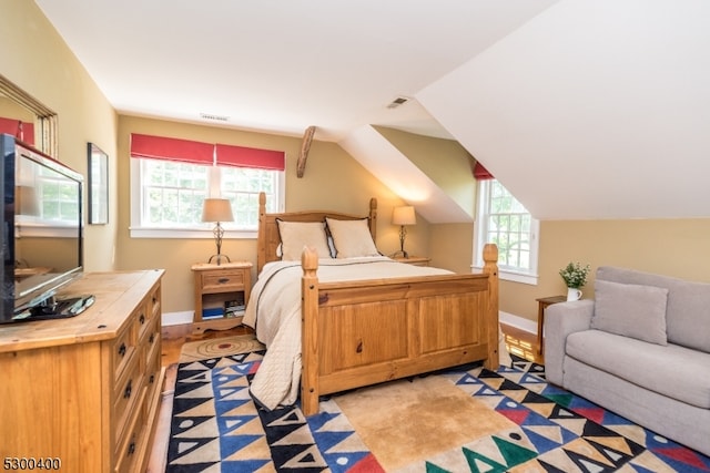 bedroom featuring vaulted ceiling