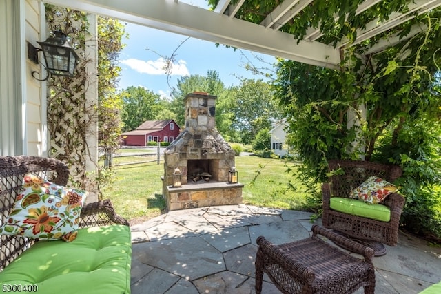 view of patio / terrace with an outdoor stone fireplace