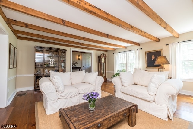 living room featuring hardwood / wood-style floors and beam ceiling