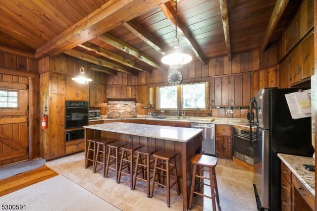 kitchen featuring wood ceiling, sink, beamed ceiling, and black appliances