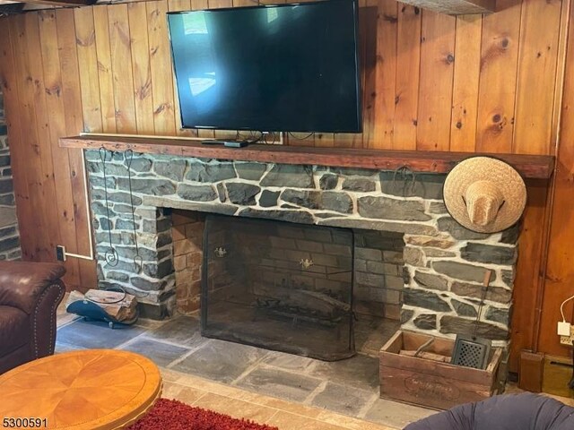 living room with a fireplace and a wealth of natural light