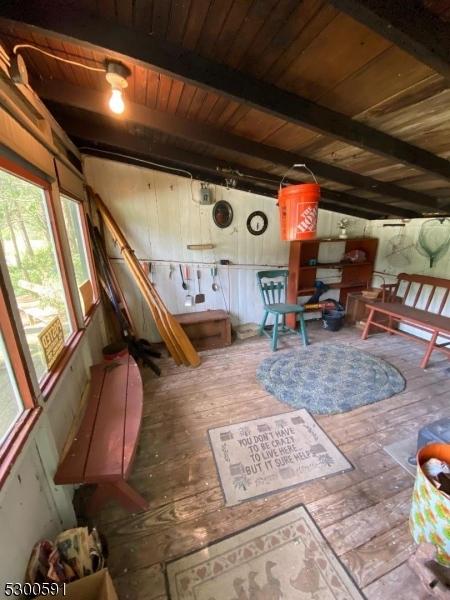 interior space with beam ceiling and wood ceiling