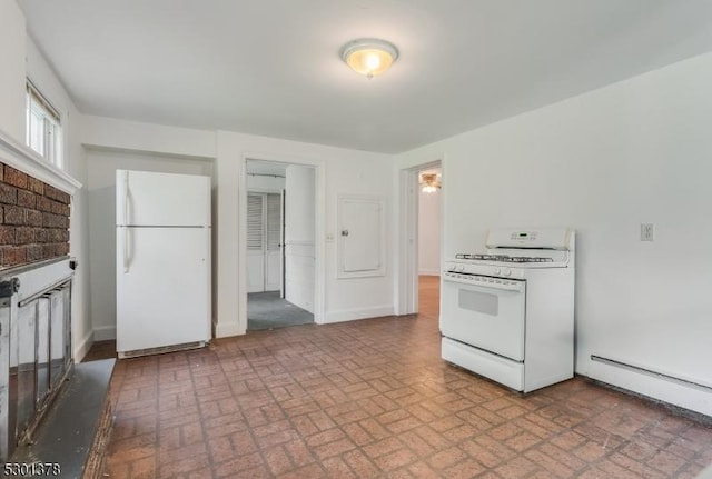 kitchen featuring white appliances, brick patterned flooring, baseboards, and baseboard heating
