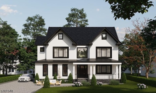 view of front of property with covered porch and a front lawn