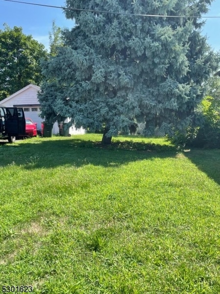 view of yard with a garage