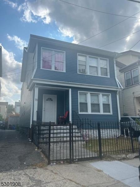 70 Campfield St, Irvington Twp, NJ 07111 - view of front of house with a fenced front yard
