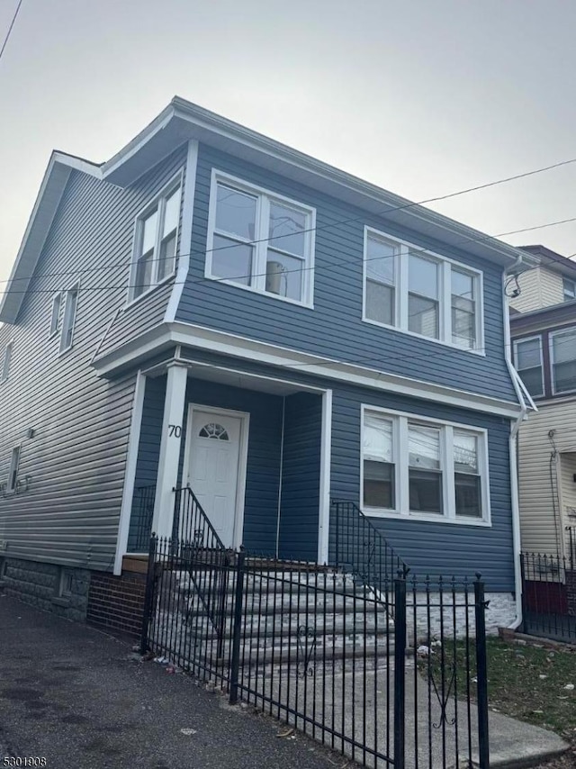 70 Campfield St, Irvington Twp, NJ 07111 - view of front of home with a fenced front yard and entry steps