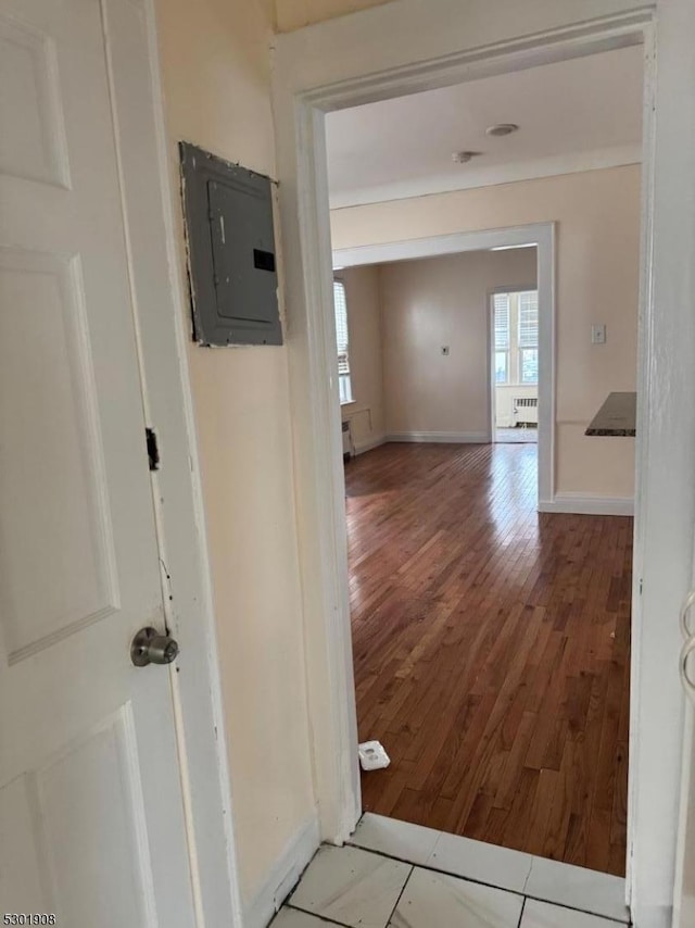 70 Campfield St, Irvington Twp, NJ 07111 - hall with baseboards, wood finished floors, electric panel, and radiator