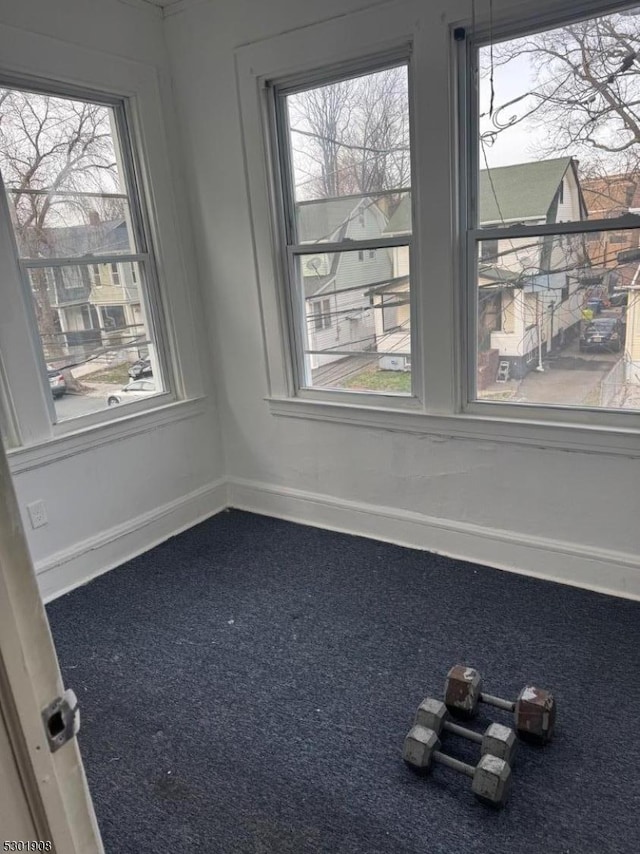 70 Campfield St, Irvington Twp, NJ 07111 - empty room featuring baseboards and dark colored carpet
