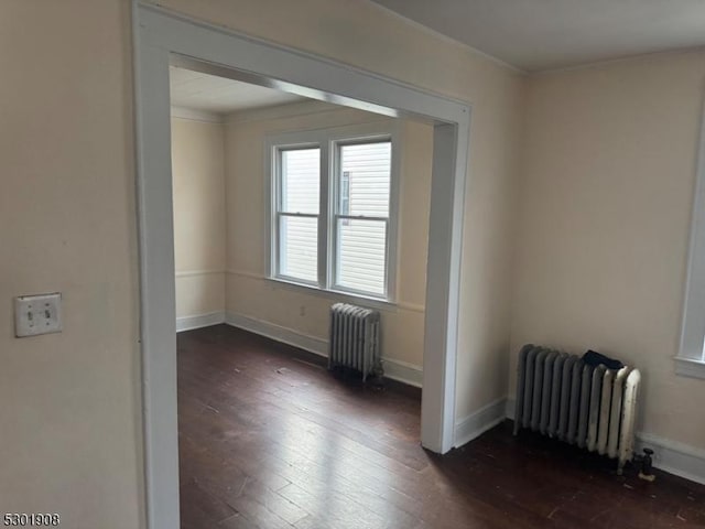 70 Campfield St, Irvington Twp, NJ 07111 - empty room with radiator, dark wood-type flooring, and baseboards