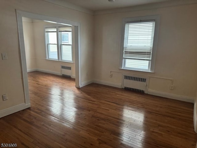70 Campfield St, Irvington Twp, NJ 07111 - empty room featuring radiator, hardwood / wood-style flooring, and baseboards