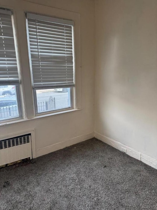 70 Campfield St, Irvington Twp, NJ 07111 - carpeted spare room with baseboards and radiator heating unit