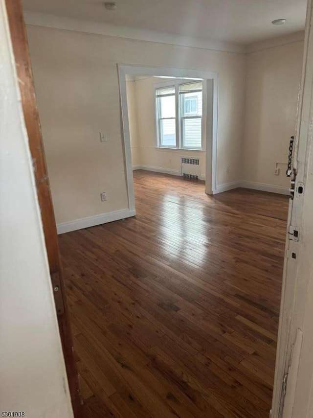 70 Campfield St, Irvington Twp, NJ 07111 - empty room featuring baseboards, wood finished floors, and radiator heating unit