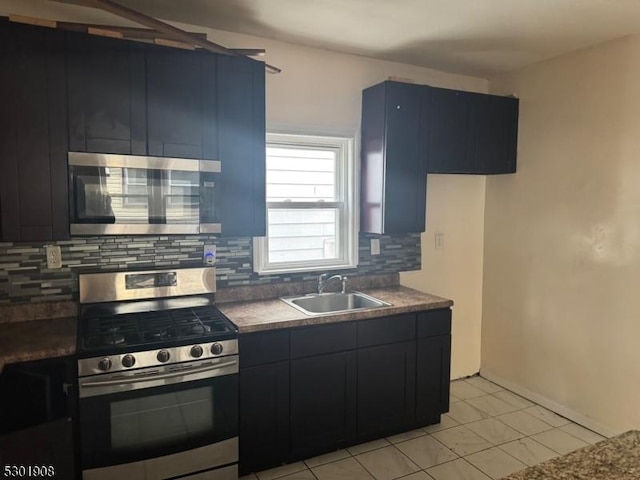 70 Campfield St, Irvington Twp, NJ 07111 - kitchen featuring dark cabinetry, backsplash, a sink, dark countertops, and appliances with stainless steel finishes