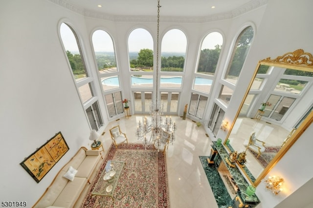 interior space featuring ornamental molding and a high ceiling