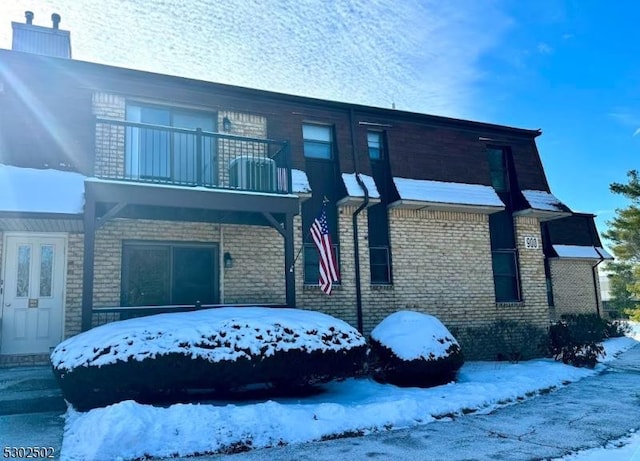 view of front of house featuring a balcony