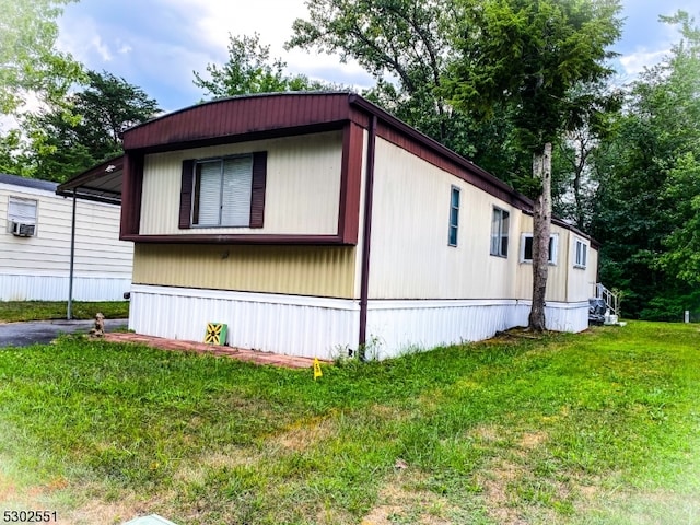 view of property exterior with a yard