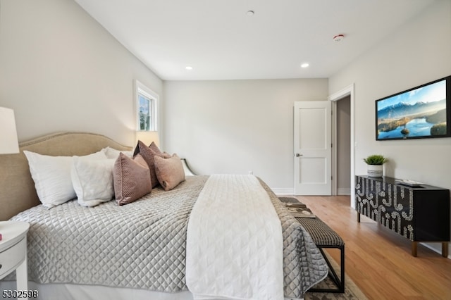 bedroom with hardwood / wood-style flooring