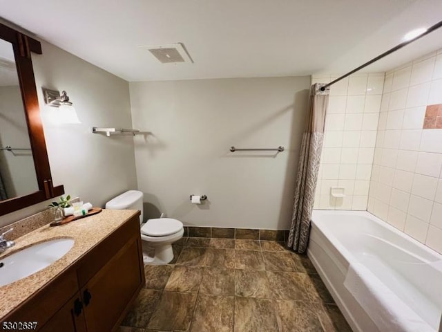 full bathroom with vanity, toilet, and shower / tub combo with curtain