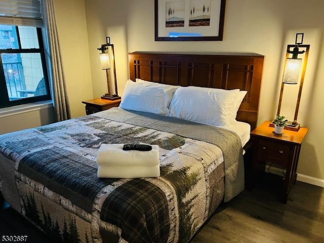 bedroom with hardwood / wood-style floors